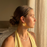 Eventail Earrings worn — sculptural gold fan earrings, waterproof and hypoallergenic