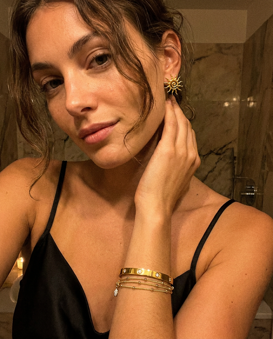 Solea Earrings worn — sculptural gold sun studs, waterproof and hypoallergenic