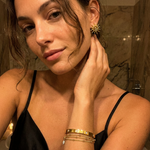 Solea Earrings worn — sculptural gold sun studs, waterproof and hypoallergenic