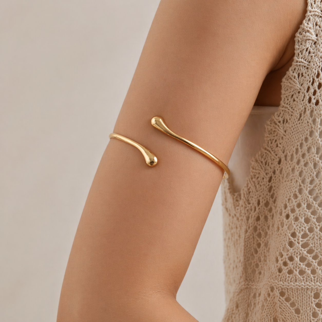 St. Tropez Bracelet worn — sun-warmed gold bangle, waterproof and hypoallergenic